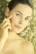 Photo: Portrait of young woman with foundation make-up dots under her eyes Portrait of young woman with foundation make-up dots under her eyes