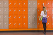 Student unlocking school locker