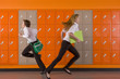 Students rushing past school lockers