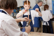 Photo: Student looking at plumbing faucet in vocational classroom Student looking at plumbing faucet in vocational classroom