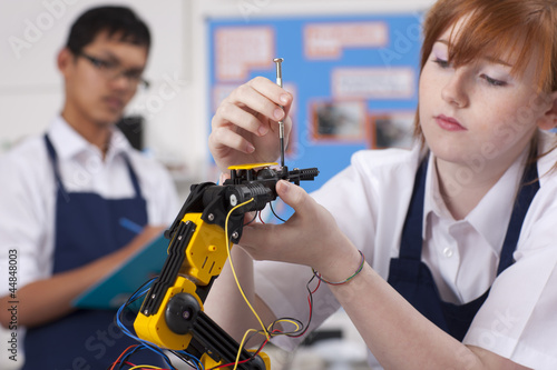 Photo: Student working on robotic device in vocational class Student working on robotic device in vocational class