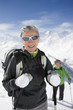 Couple hiking up ski slope on mountain