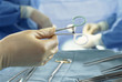 Close up of surgeon holding scissors in operating room