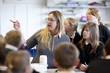 Science teacher and students in laboratory classroom