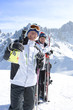 Foto: Portrait of smiling senior men with skis on snowy mountain Portrait of smiling senior men with skis on snowy mountain