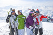 Foto: Smiling senior couples with skis on snowy mountain Smiling senior couples with skis on snowy mountain