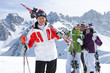Foto: Portrait of smiling senior couples with skis on snowy mountain Portrait of smiling senior couples with skis on snowy mountain