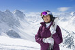Foto: Portrait of smiling senior woman with skis on snowy mountain Portrait of smiling senior woman with skis on snowy mountain