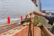 Bricklayer laying brick wall