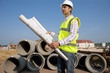 Photo: Architect reviewing blueprints at construction site Architect reviewing blueprints at construction site
