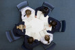 Students reading at round table in school library