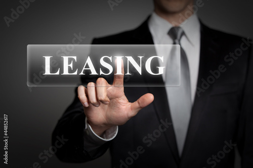 Photo: businessman pressing touchscreen button - Leasing businessman pressing touchscreen button - Leasing