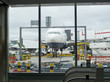 Airplane parked at airport jetway