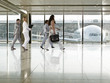 Business people walking in airport terminal
