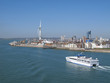 Ferry boating past cityscape of Portsmouth with modern spire in background