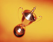 Ornate silver trophy on yellow background