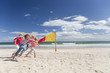 Kids running on sunny beach