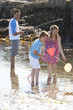 Photo: Parents and son fishing in tide pool Parents and son fishing in tide pool
