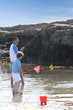 Photo: Father and son fishing in tide pool Father and son fishing in tide pool