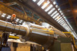 Engineer working on metal machinery