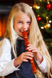 girl playing recorder on christmas eve