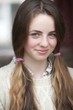 Close up portrait of smiling girl with pigtails