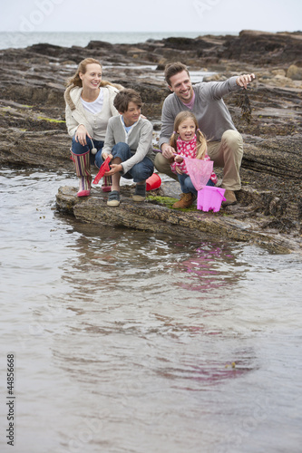 Photo: Family fishing on rocks with nets Family fishing on rocks with nets