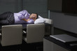 Businessman sleeping on conference table