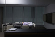 Businessman sleeping on conference table with paperwork covering face
