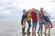 Portrait of smiling teenage girls on beach