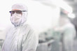 Photo: Portrait of scientist in clean suit in silicon wafer manufacturing laboratory Portrait of scientist in clean suit in silicon wafer manufacturing laboratory