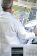 Photo: Engineer examining circuit diagram in laboratory Engineer examining circuit diagram in laboratory