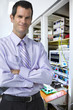 Portrait of confident, businessman in silicon wafer manufacturing laboratory