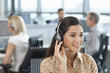 Business people wearing headsets in office