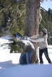 Couple having snowball fight outdoors