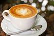 Cappuccino or latte coffee with heart shape
