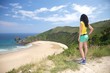 woman watching Torimbia beach