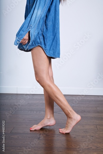 Photo: walking barefoot with denim shirt walking barefoot with denim shirt