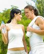 Photo: Cheerful couple on outdoor fitness workout Cheerful couple on outdoor fitness workout