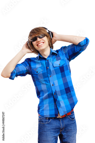 Photo: Happy smiling young man dancing Happy smiling young man dancing