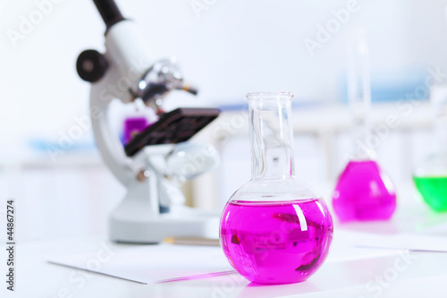 Photo: Chemistry laboratory glassware with colour liquids Chemistry laboratory glassware with colour liquids