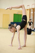 Photo: young gymnast stretching and training young gymnast stretching and training