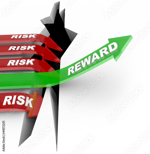 Photo: Risk Vs Reward Words Arrow Rises Over Hole Risk Vs Reward Words Arrow Rises Over Hole
