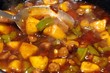 Sweet and sour chicken cooking