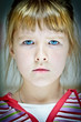 Facial portrait of a caucasian girl with blue eyes