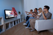 Photo: Family watching 3D television Family watching 3D television
