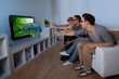 Family watching 3D television