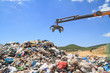 Grabber crane working in landfill