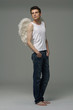 Handsome male angel. Shot in a studio.
