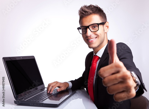 Photo: business man working and showing ok business man working and showing ok